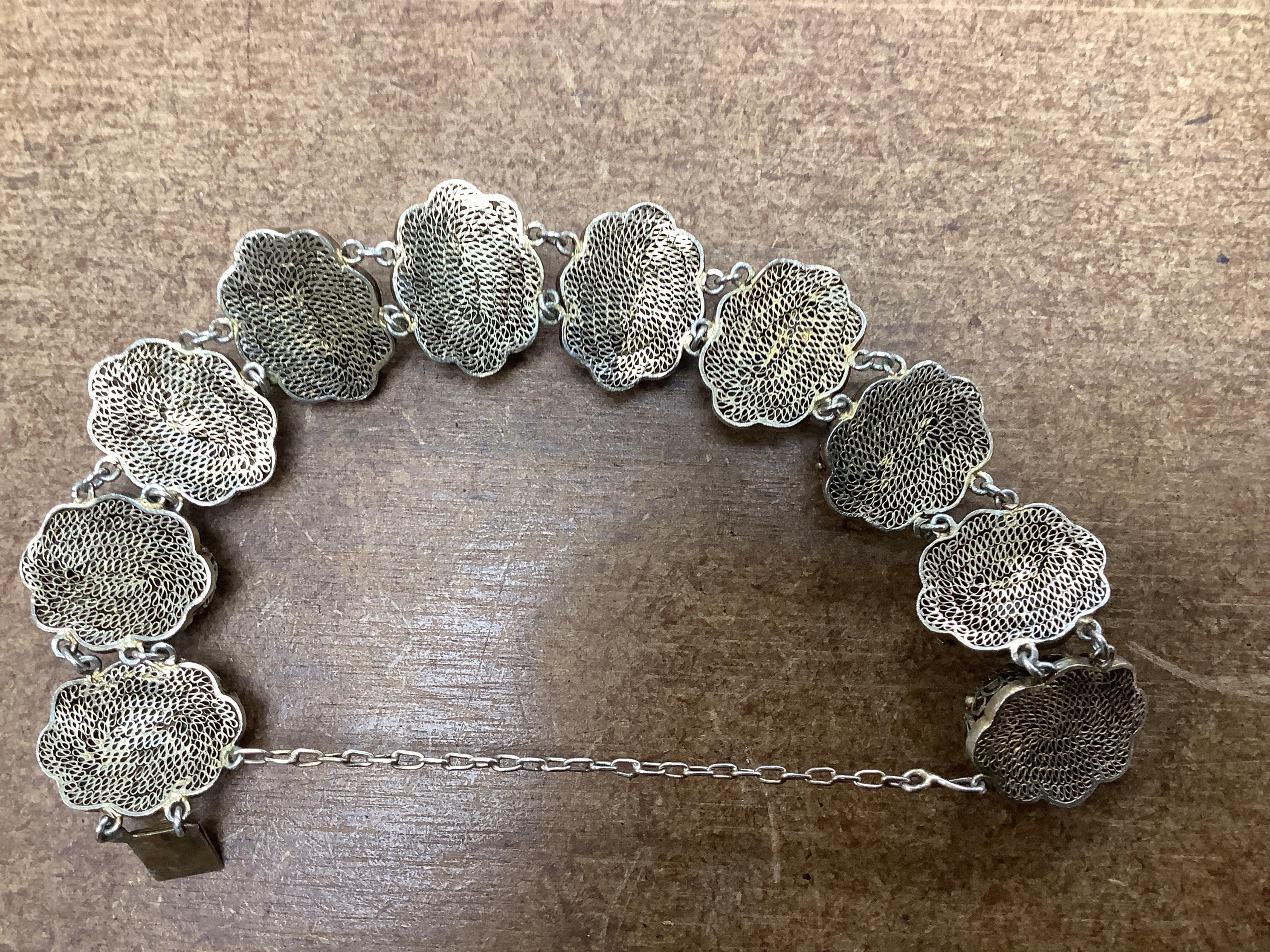 Sixteen Chinese jade and hardstone carvings, including a gilded white metal and jadeite bracelet, three pendants etc. Condition - fair